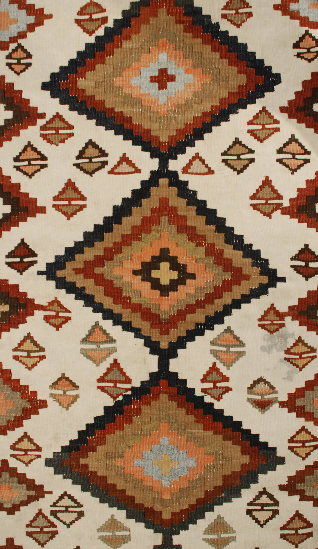An early 20th century Persian Ersin Kilim runner with a wonderful all-over diamond pattern on a cream background, surrounded by a contrasting geometric border.