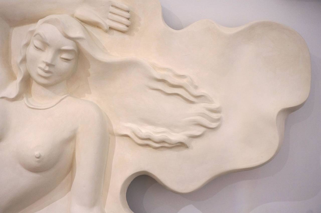 This Art Deco wall sculpture depicts a bathing beauty or perhaps a modern interpretation of Venus and her clam shell was designed and created by the architect L. Murray Dixon for the Senator Hotel located in the Art Deco District of Miami, Florida. 