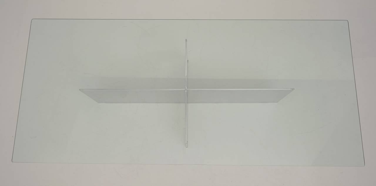 This rectangular cocktail table was designed and created by Paul Mayen for Habitat in the 1970s. It is fabricated out of cast-aluminum and has a clear glass top.

Paul Mayen was a founder of Habitat, Intrex and Architectural Supplements, Inc. He is