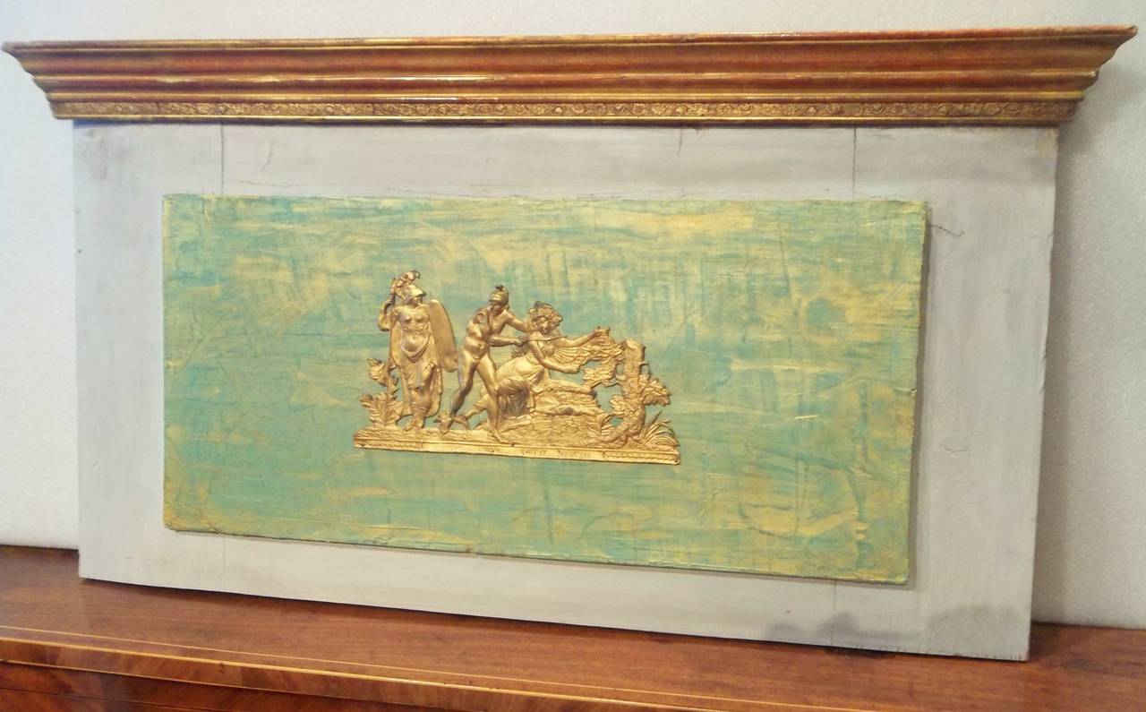 probably remnants from a trumeau or boiserie. Gilded metal scene of  possibly Perseus removing Medusa 's head under the watchful gaze of Athena (Minerva ). A colorful faux green ground with gold glaze. Elaborate gilt cornice with red bole bleeding .