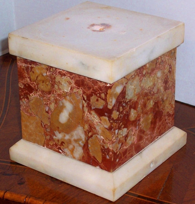 Colorful breccia marble base or plinth for display , currently also drilled for electricity  (lamp ). Probably originally had a bust or vase mounted to the base , something of importance . 

late 19th century , maybe a creep into the 20th century