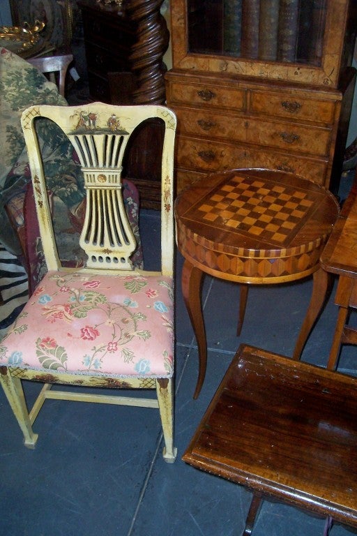 Pair of English chairs in chinoiserie / japanned decoration against a yellow ground . Sturdy . Recent upholstery in generally fine shape .