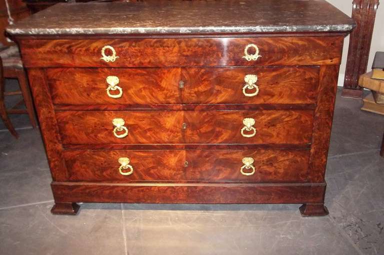 Second Empire chest, probably 1870s. Unusual in that the front veneers are highly figured crotch mahogany as opposed to the more common flame mahogany. Gilded bronze mounts with hand hewn marble top (good condition). This chest has secondary wood of