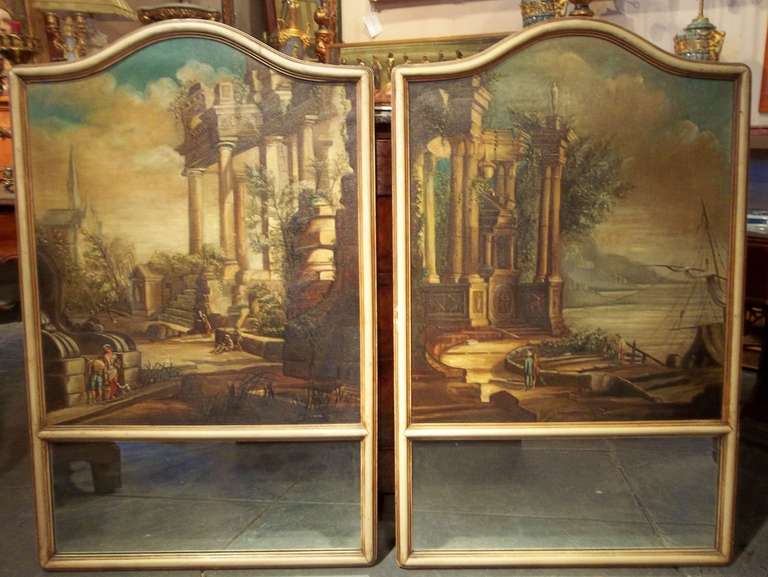 Probably Italian trumeaux given the capricci insets. In very good condition. One small patch to upper sky on one (visible from the back side).
Arched frames and mirrors.

Approximate sight of oils 29