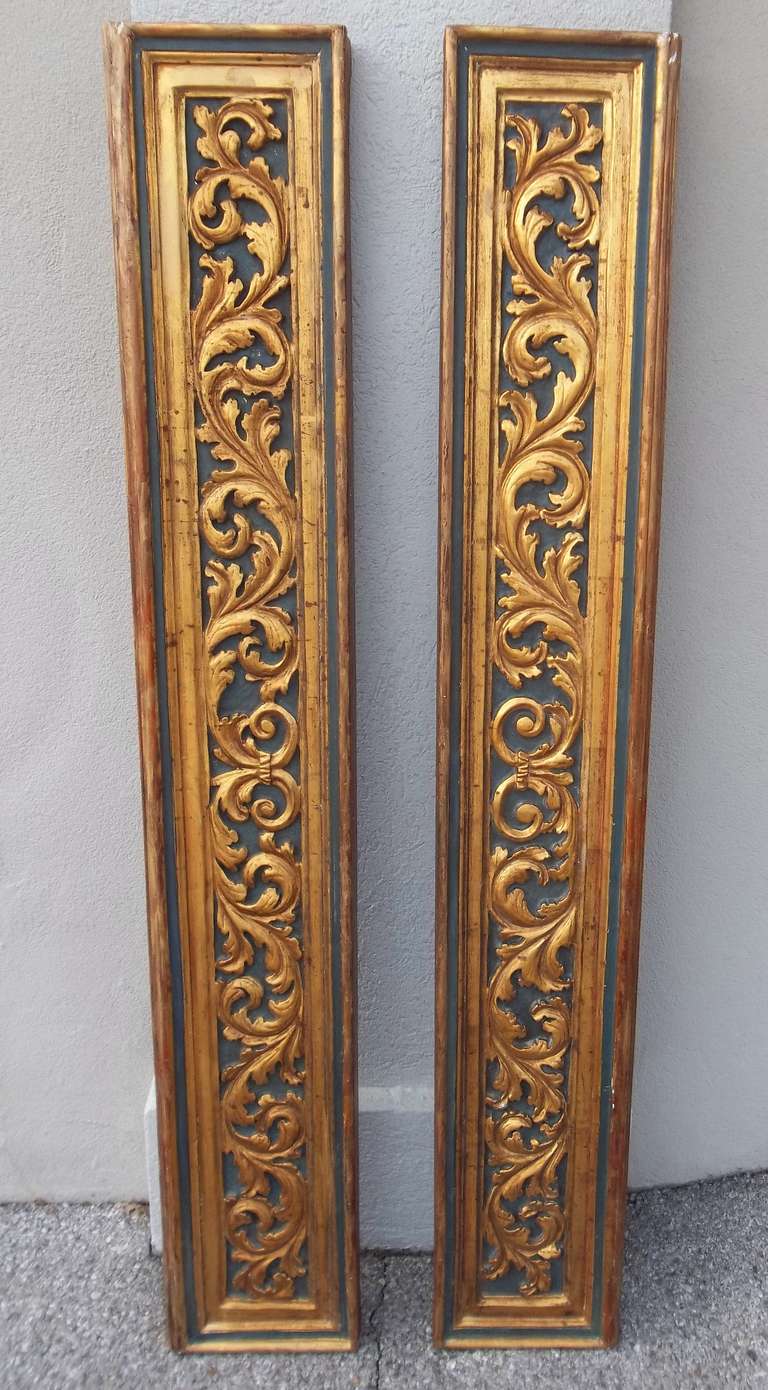 A pair of wood carved , paint and parcel gilt panels possibly overdoors  (or over windows ) or paneling fragments.Deeply and robustly carved .. 
These can be used vertically or horizontally .There is a definitive top and bottom but  of such