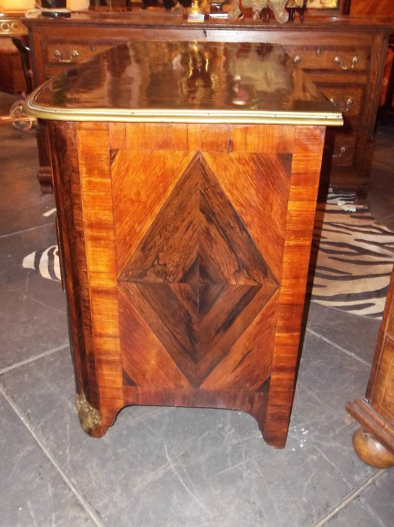 Elaborate parquetry commode, the corner stiles in herringbone pattern , the top and sides with diamond inlay .Highly figured Kingwood with bronze pulls . Finished with a well maintained French Polish  .  Very minor veneer loss, some minor repairs