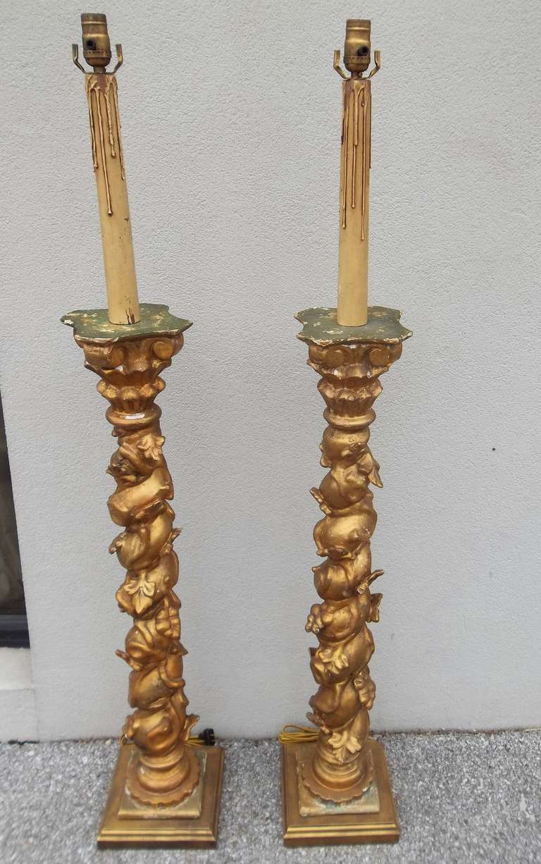 Pair of antique giltwood columns in Solomonic desgin.later mounted as lamps .
Italy circa 1900
Columns 40" tall 
To socket head 58"