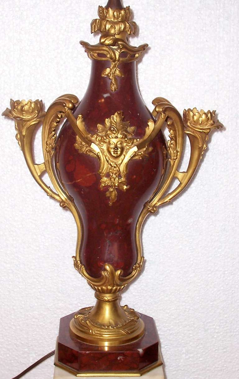 Now mounted as a lamp (but with snip of clips back to candelabrum again). Nice baluster form with ox blood red marble and gilt bronze fittings. Three candle fittings

France or Italy 

17.5 inches tall
10 inches wide
 6 inches deep (front to