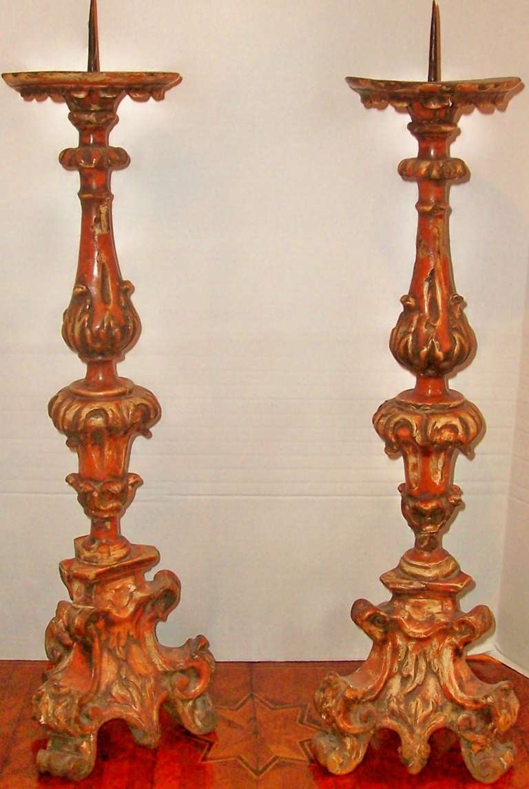 A Pair Of Italian Polychrome Prickets Or Candlesticks