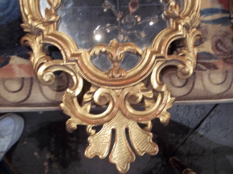 20th Century Pair of Louis XV Style Giltwood Mirrors with Sconces in Water Gilt