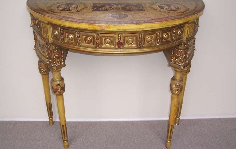 Soft yellow paint with gilt ornamentation. The skirt decorated with urns , floral festoons , ribbons and coffer plaques.
The top with Italian panel  reminiscent of Pompeii frescoes .Nicely distressed throughout .The paint and gilding worn in places