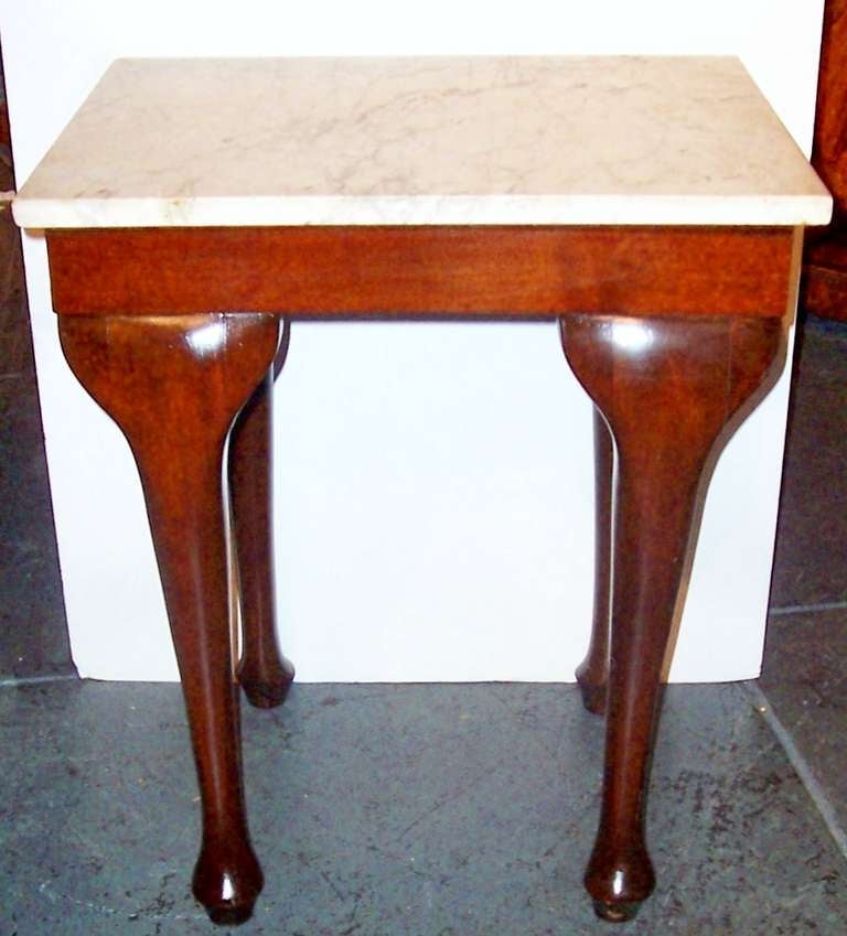 A rich mahogany patina to this late Georgian styled console or  side table (dual purpose ) .Nicely grey veined carrera marble top.  Modified pad feet ..