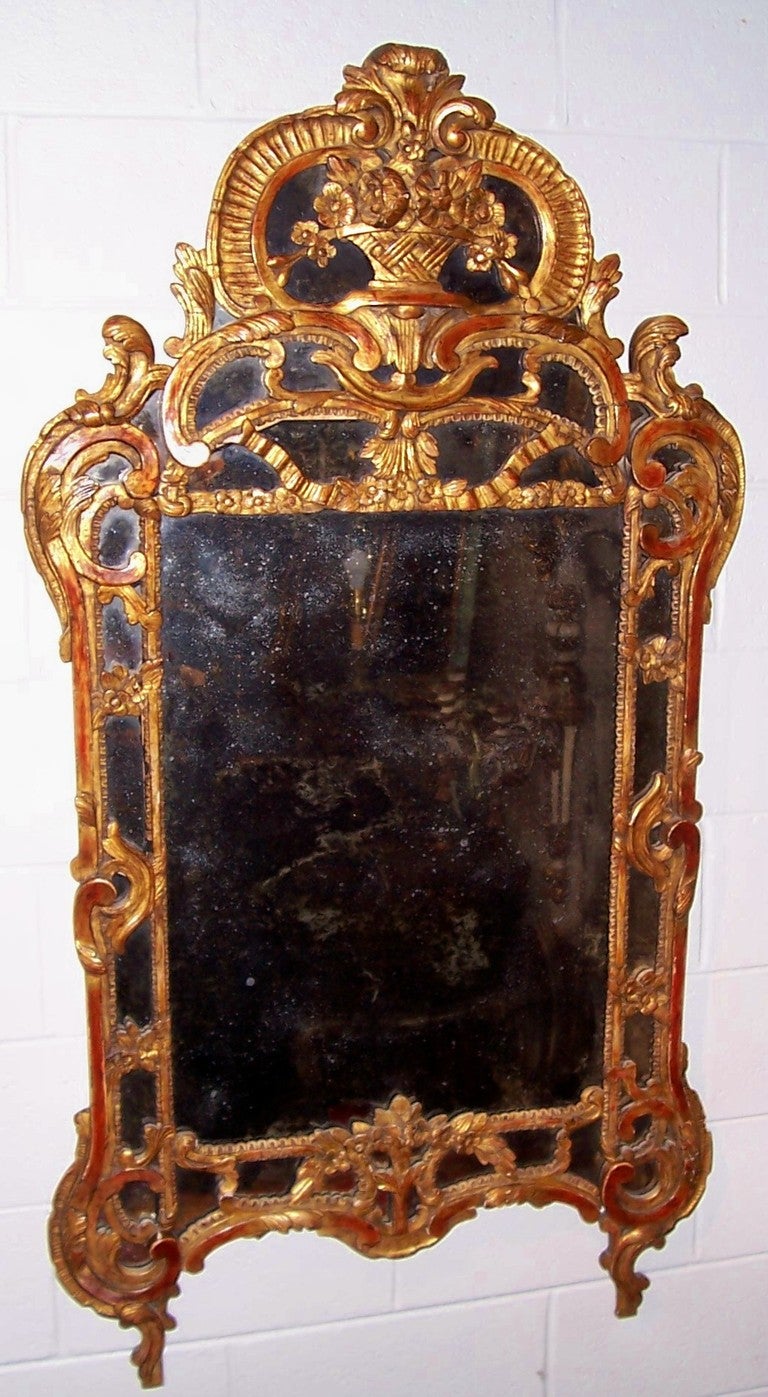 Regence - Louis XV style transitional giltwood mirror