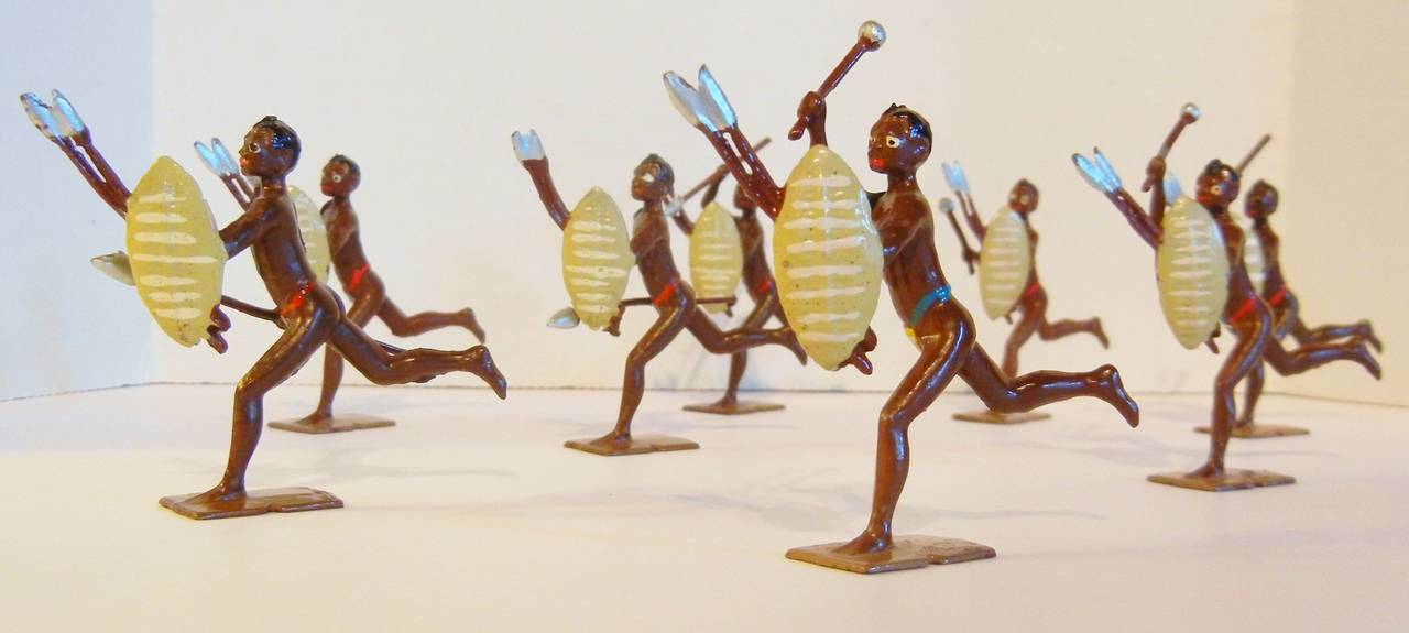 This eight-piece set of toy soldiers (Set #147 by Britains Ltd.) is its in original paint, and depicts Zululand warriors from the army of King Cetshwayo (reigned 1872-79). They are charging with straw-colored shields on their stationary left arms