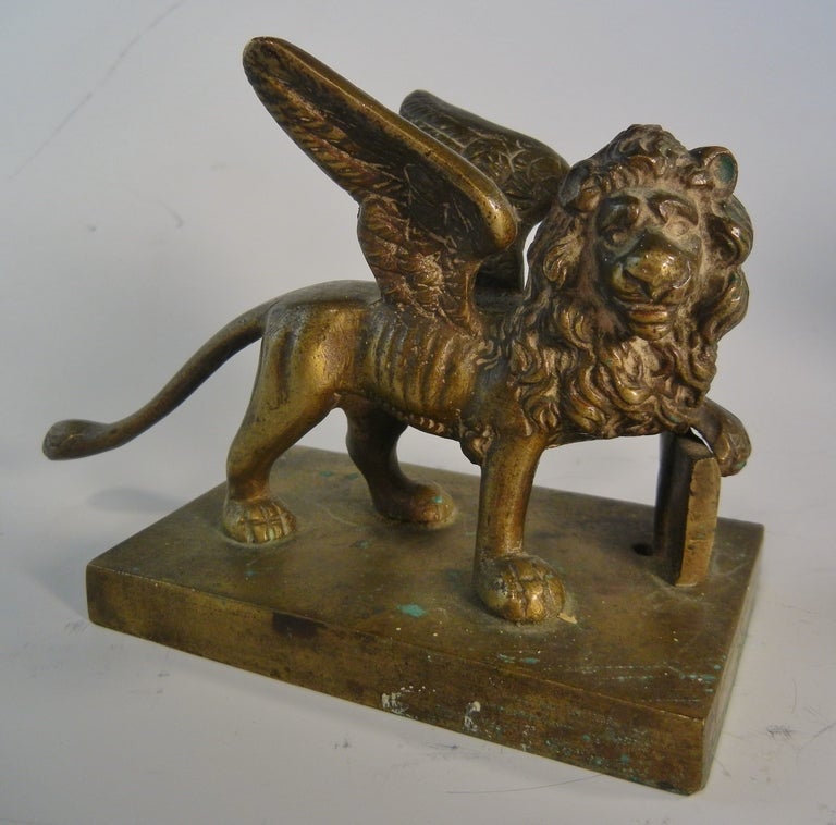 Table-top size Grand Tour Souvenir bronze model of the Lion of Venice with open Bible after the antique in St. Mark's Plaza, Venice. This model has a natural patina built up on the bronze, with a nice clear casting.

The open Bible symbolizes a