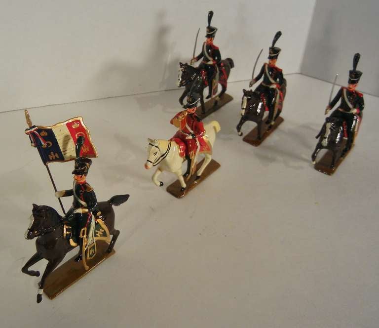 C.B.G. Mignot five-piece set depicting the Chasseurs of 1809, from the famous Imperial light cavalry regiment attired in dark green tunics with red facings. They are hand-painted in great detail over solid lead alloy, done in Mignot's mid-century