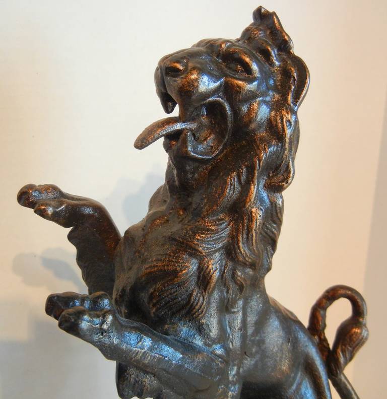 20th Century Rampant Lion Bookends on Marble Plinths in Cast Iron