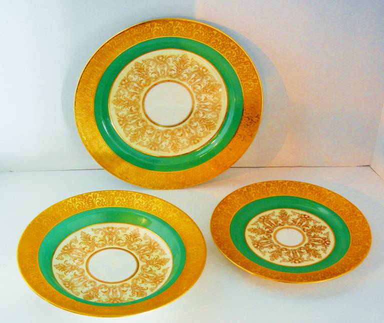 This set of hand-decorated Limoges porcelain consists of ten dinner plates (10.5