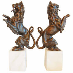 Rampant Lion Bookends on Marble Plinths in Cast Iron