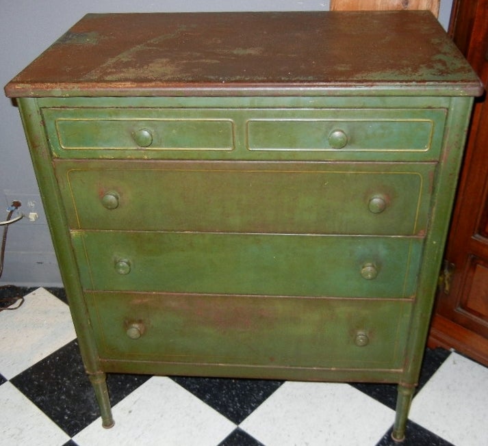 All original, green-painted metal chest of four drawers in the Sheraton style in perfect proportions and with fine patina and well-used industrial surface. This chest fools everyone in my shop...the first impression is that it is a period chest in