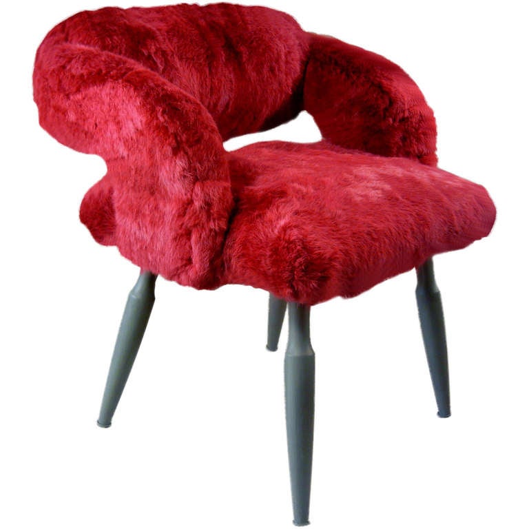 This signed, artist-designed chair is by Rodrigo Velasquez Godoy, a Montreal--based contemporary sculptor, painter and designer. Here he used a Mid-Century vanity chair to create a one-of-a-kind boudoir chair upholstered in fuchsia-dyed rabbit fur