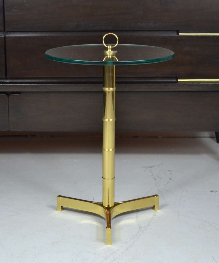 A very sleek newly polished brass side table after Edward Wormley.