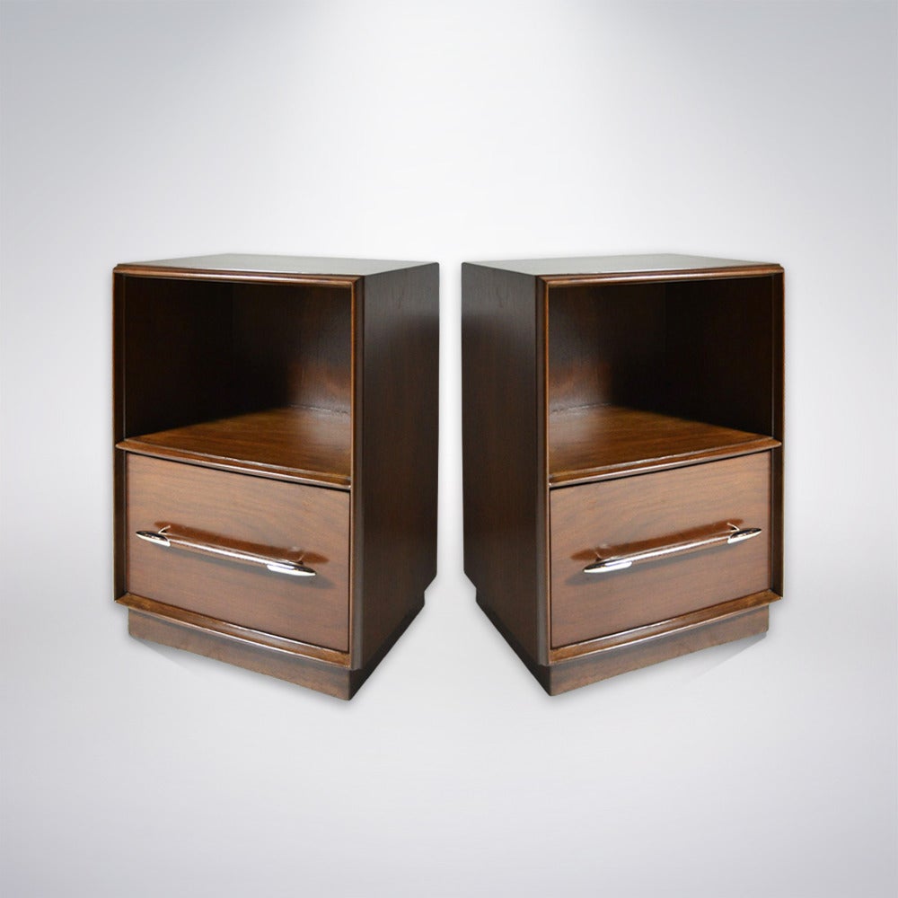 Classic pair of nightstands or side tables designed by T.H. Robsjohn-Gibbings for Widdicomb. Newly refinished in medium walnut, metal spear tip shaped appliques on handles have been newly nickel-plated. Additional pair available.