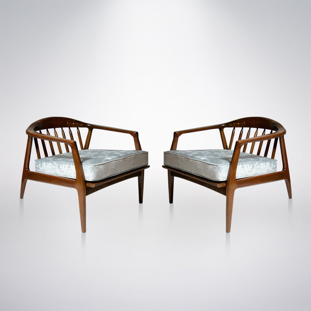 Mid-Century Modern pair of walnut lounge chairs design by Milo Baughman for Thayer Coggin. Newly refinished in natural. New seat cushion upholstered in silver chenille.