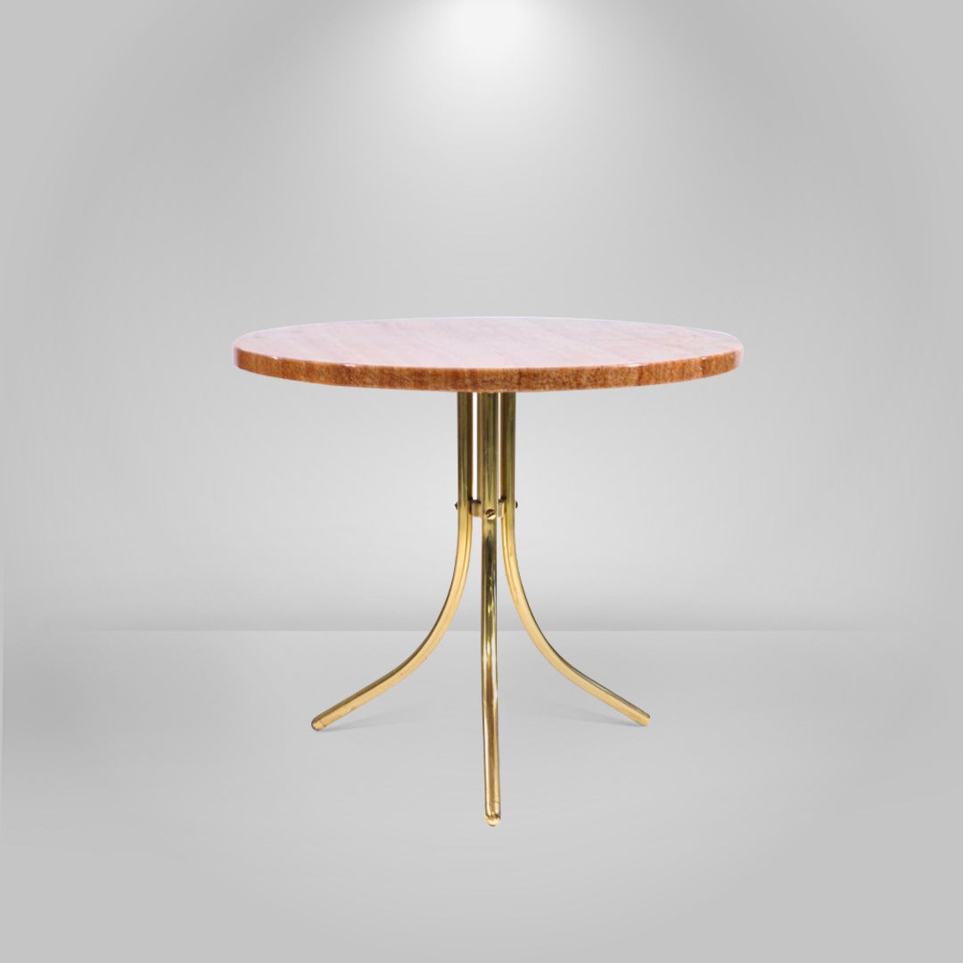 Brass and marble side or end table in the style of Gio Ponti. Newly polished marble top atop a brass tripod base.