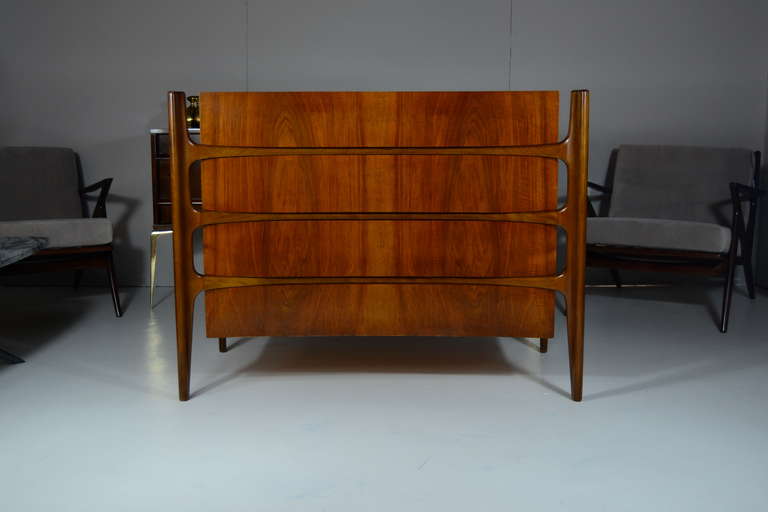 Rare pair of rosewood chest of drawers or bedside tables by Swedish furniture designer Edmund J. Spence. Very unique exposed frames, each chest features four slightly curved front drawers. Newly refinished and in mint condition.