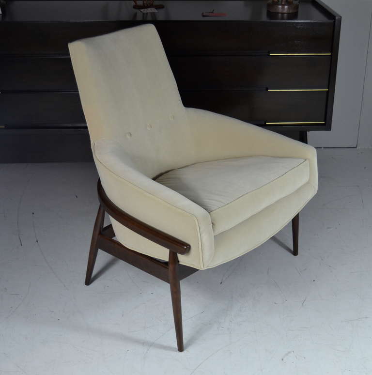 Great pair of highback lounge chairs by Milo Baughman. Sculptural walnut frames newly refinished in natural as well as brand new ivory velvet blend upholstery.