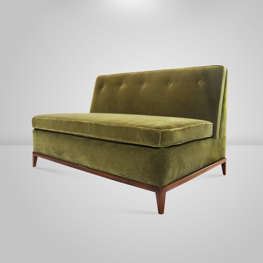 A lovely Mid-Century Modern loveseat or settee designed by T.H. Robsjohn-Gibbings for the Widdicomb furniture company. 

Newly upholstered in green mohair, walnut base newly refinished in a medium tone.