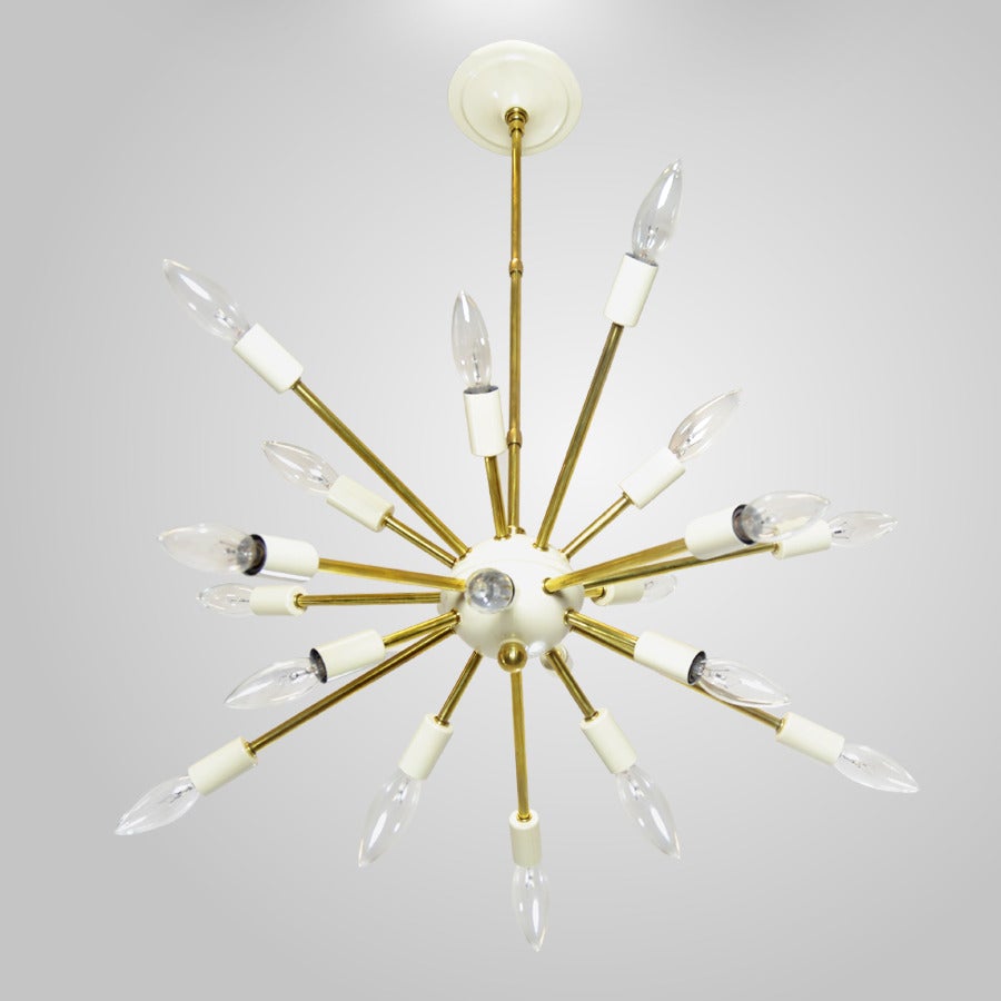 Sputnik chandelier in manner of Arredoluce manufactured in Italy, circa 1950s. This rare fixture features eighteen brass arms ending in enameled aluminum sockets and center structure.

Newly polished and rewired.