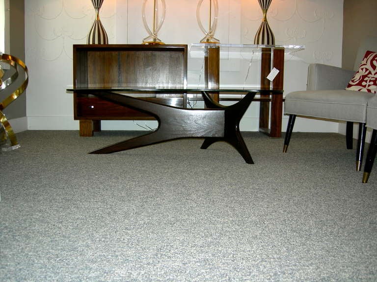 Asymmetrical, kidney shaped table by mid-century innovator Adrian Pearsall. Base newly refinished in a beautiful dark chocolate tone with a satin finish. New glass top.