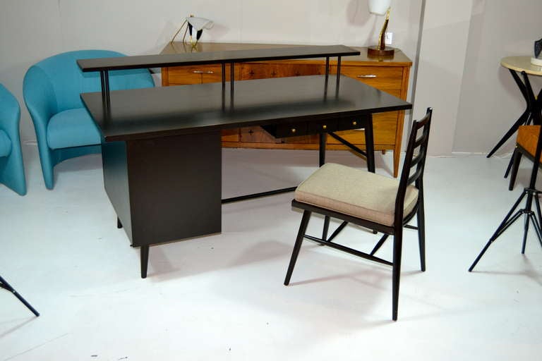 A very rare ebonized Paul McCobb designed desk and chair for O’Hearn Furniture / Predictor Line.

Paul McCobb (June 5, 1917 – March 10, 1969) was a modern furniture and industrial designer. McCobb was born in Medford, Massachusetts to Raymond and