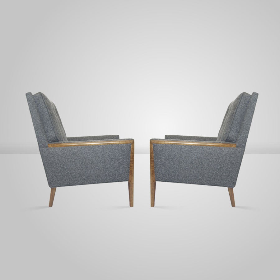 Pair of club chairs in the manner of T.H. Robsjohn-Gibbings.