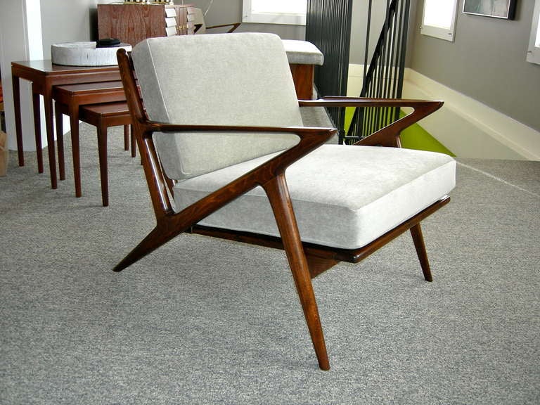 Pair of modern chairs designed by Poul Jensen for Selig with labels. Teak wood frames have been newly refinished in a dark walnut tone with a satin finish. Also newly upholstered in fine grey velvet.