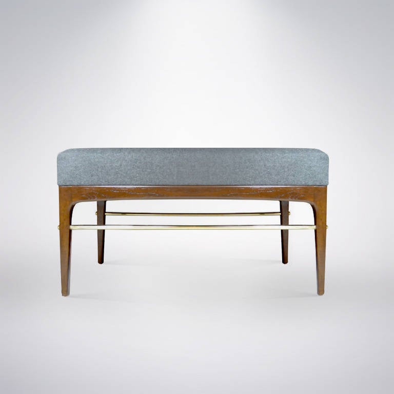 Phenomenal pair of Mid-Century walnut frame benches newly fitted with brass rods and fasteners. Newly refinished in natural and re-upholstered in a grey flannel.
