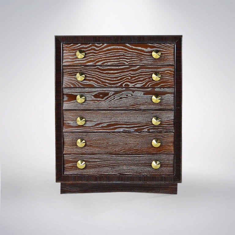 A phenomenal gentleman's chest or dresser designed by Paul Frankl for Brown Saltman. Six drawers featuring large brass pulls provide ample storage space. Newly refinished.