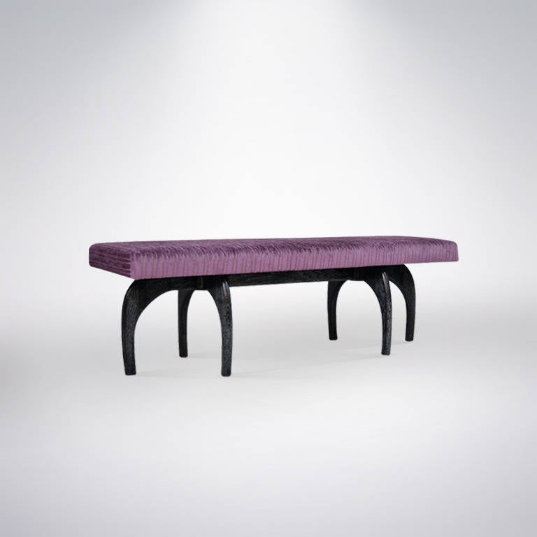A very chic sculptural base bench newly refinished in cerused. Top newly upholstered in a silver stripped purple velvet.