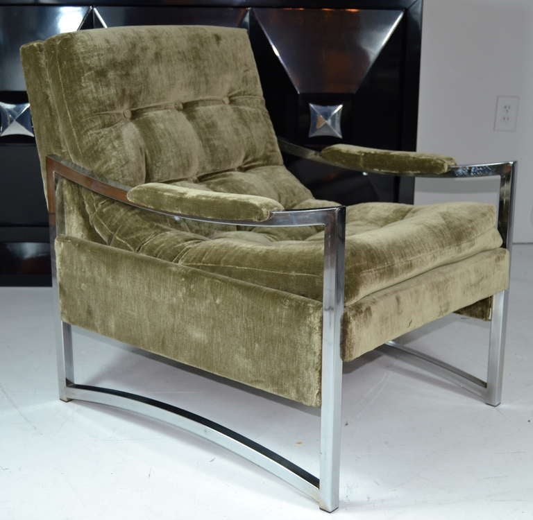 A pair of chrome framed lounge chairs newly upholstered in olive green mohair.