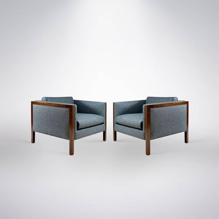 Large pair of lounge or club chairs in the manner of Milo Baughman for Thayer Coggin. Newly upholstered in a smokey grey flannel and walnut frames refinished in a medium tone.