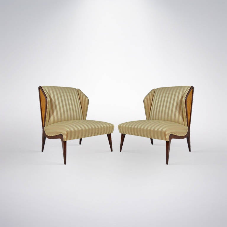 A beautiful and unusual pair of lounge chairs designed and manufactured in Italy circa 195's. Walnut frames newly refinished in natural.

Re-upholstery in COM available and included in price. Lead time 7-10 days.