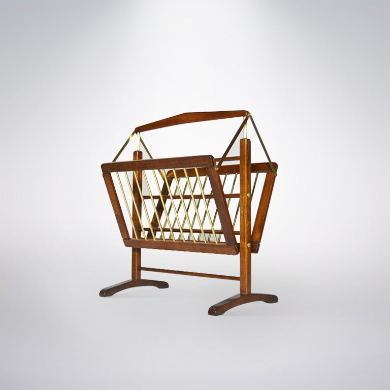 Sculptural walnut and brass magazine rack manufactured in Italy, circa 1950s. Newly refinished and polished.