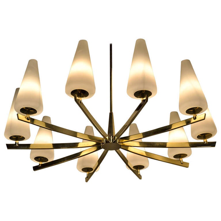 A handsome brass chandelier featuring ten arms ending in frosted glass shades. Manufactured in Italy, circa 1950s. Newly polished, rewired and ready to hang.