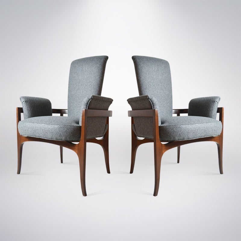 Pair of Mid-Century Modern armchairs by James Mont. Sculptural walnut frames newly refinished in natural. Newly reupholstered in grey high grade wool.