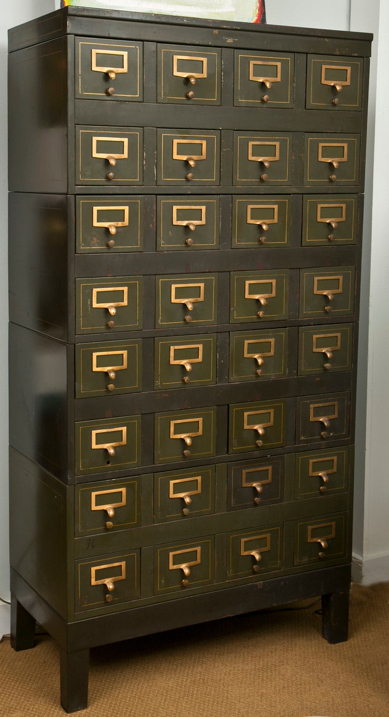 32 Drawer metal card file from The Library of Congress. All original brass finger-pulls and card knobs with gilt paint outlining throughout.Four component, uber-useful, and definitely Industrial Chic.