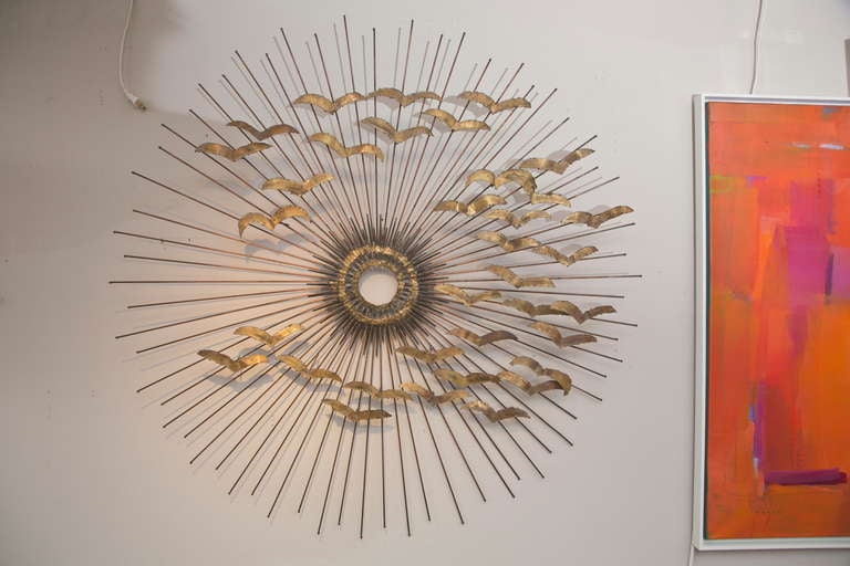 A wonderful, older Jere wall sculpture which combines his magnificent copper rod sunburst with a flock of brass seagulls. One of the best!