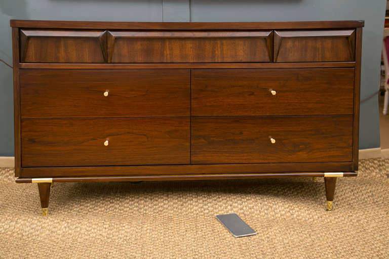 Excellent proportions with the mid-size dimensions that are so suitable for a variety of interior needs. Early 1960's all wood cabinet by Bassett Furniture has been finished in Dark Chocolate Lacquer. We have added solid brass pulls designed by Paul