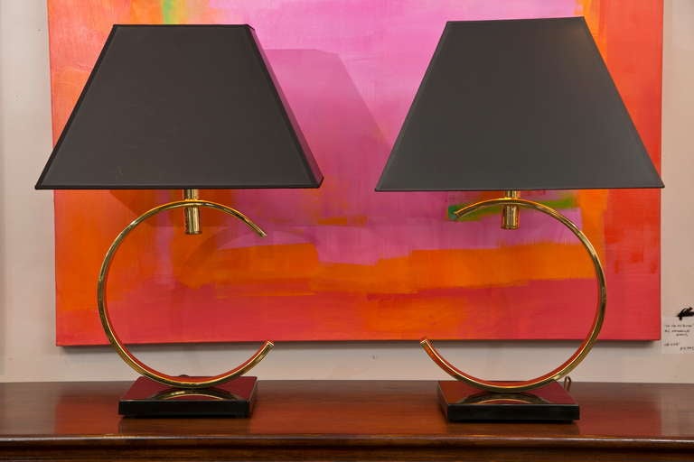 Mid-century Arc Table lamp pair with great proportions and presence. Custom black with gold interior shades have been retro-fitted. Very slight age spotting in a couple of places on the brass, which do not detract at all. Black stone bases. Solid